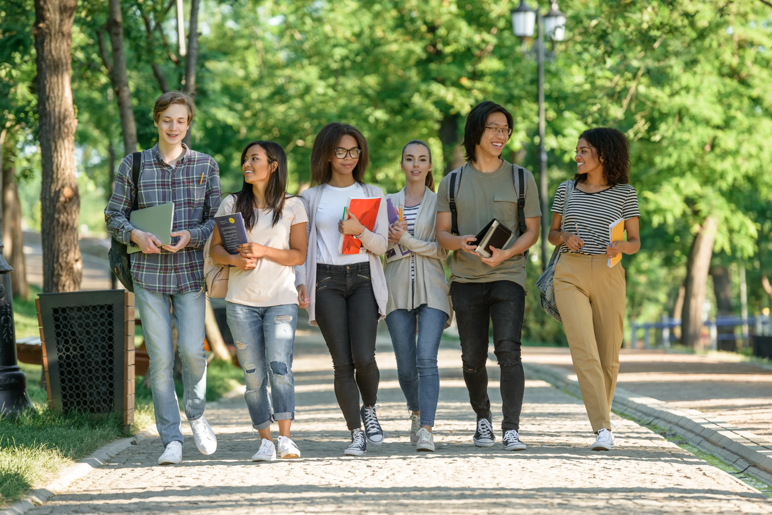 Students walking and talking on a college campus